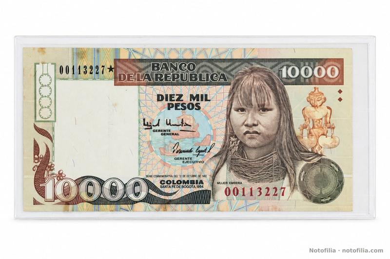 Face of the 10,000 pesos, Pick 437A / TBB B980az: Emberá woman, Quimbaya poporo, the date 1994, and serial 00113227 with a replacement star.