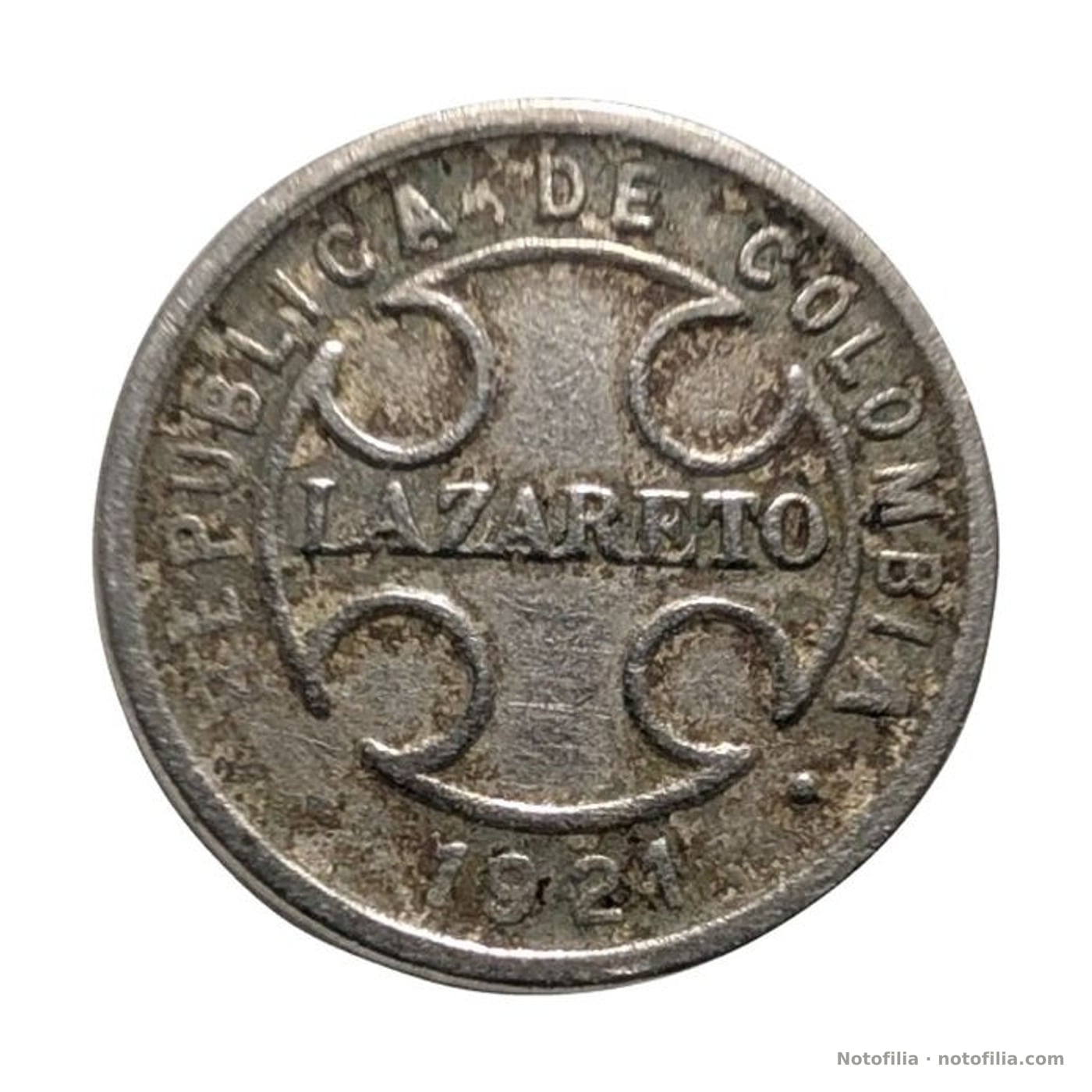 Anverso: cruz con LAZARETO, leyenda REPUBLICA DE COLOMBIA y fecha 1921.