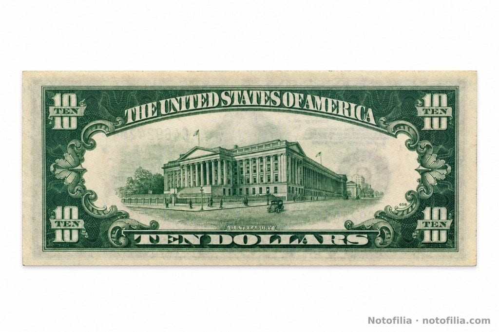 Reverso del 10 dólares, serie 1934 A: edificio del Tesoro y TEN DOLLARS. Plancha 658. Sin lema IN GOD WE TRUST.