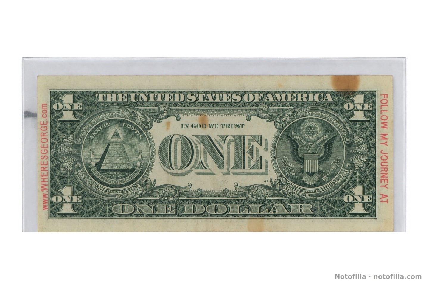 Back of the Series 2006 $1: the Great Seal and, in the margins, FOLLOW MY JOURNEY AT / www.WHERESGEORGE.com.