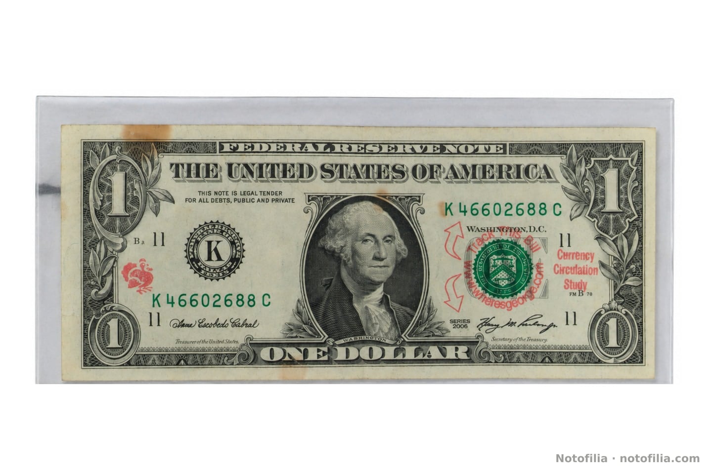 Face of the Series 2006 $1, Dallas district, serial K46602688C: Washington, the green Treasury seal, and red Where’s George? stamps.