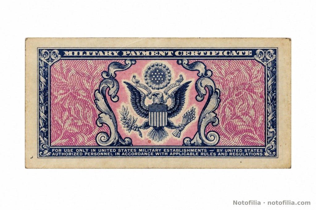 Reverso del 5 centavos, serie 481: águila con escudo y la restricción de uso para personal autorizado.