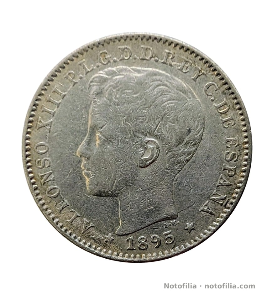 Anverso: busto de Alfonso XIII niño a la izquierda; ALFONSO XIII P.L.G.D.D. REY C. DE ESPAÑA; 1895 entre estrellas.