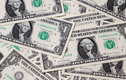 Close-up of a stack of 2017 series U.S. one-dollar notes with George Washington
