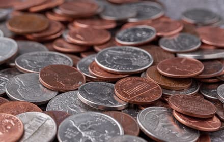 A group of older and modern U.S. coins on a dark surface