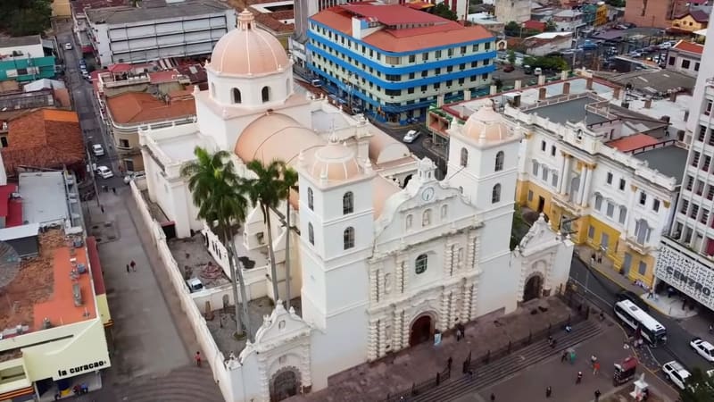 Facade of San Miguel Arcángel Cathedral in central Tegucigalpa, with the bell tower against a September sky